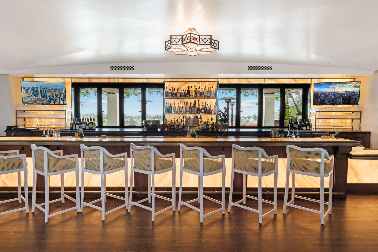 Multiple televisions above the bar at Montecito Club